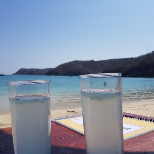 Glasses on table at the beach